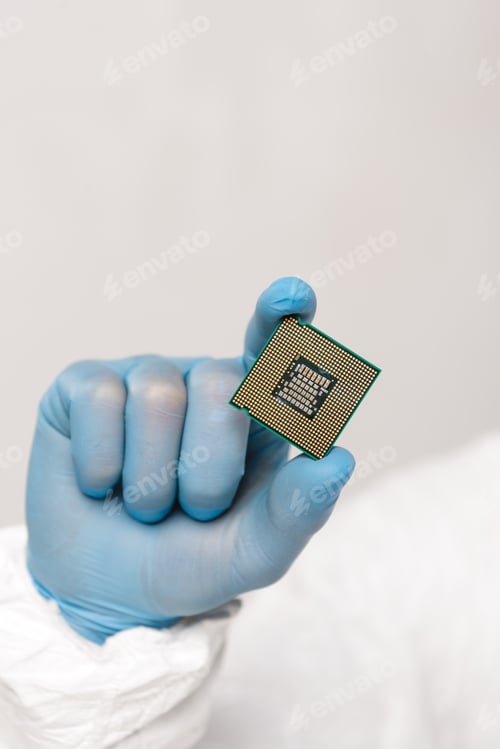 Preview: cropped view of microchip in hand of scientist isolated on grey