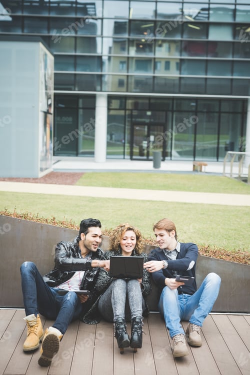 Preview: Multiracial business people working outdoor in town
