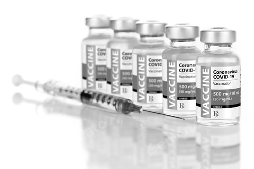 Preview: Coronavirus Vaccine and Syringe on White Background