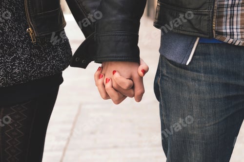 Preview: Man and woman holding hands on the street