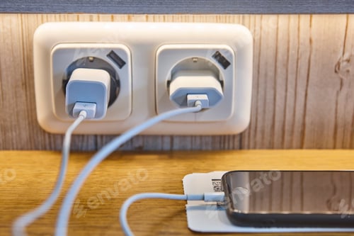 Preview: Loading smart telephones at the airport. Low battery. Adapters