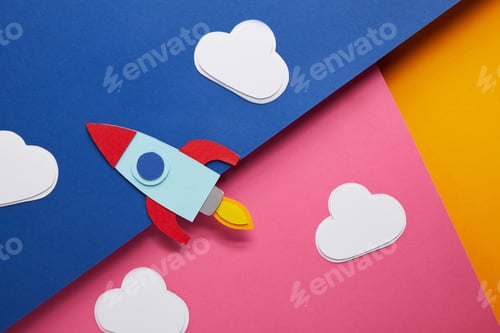 Preview: top view of clouds and rocket on colorful paper background