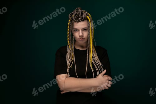 Preview: Woman With Yellow Dreadlocks Standing With Arms Crossed