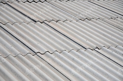 Preview: A fragment of a gray slate roof of an old sample made of asbestos material