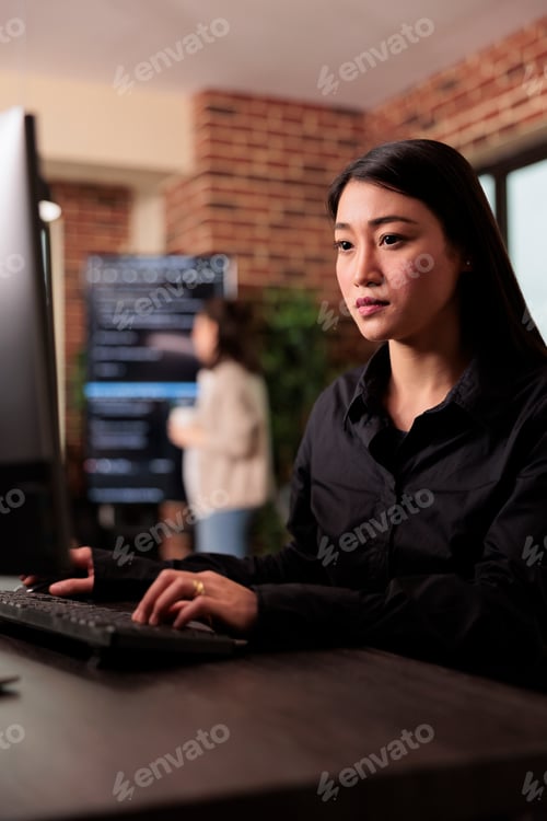 Preview: Asian programmer working with html script on terminal window