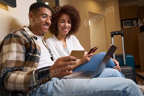 Preview: Smiling man and woman holding passports in their hands