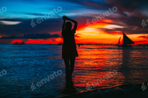 Preview: Young fashion woman in green dress on the beach