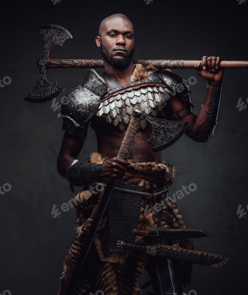 Preview: Black skinned antique soldier with dual axes looking at camera