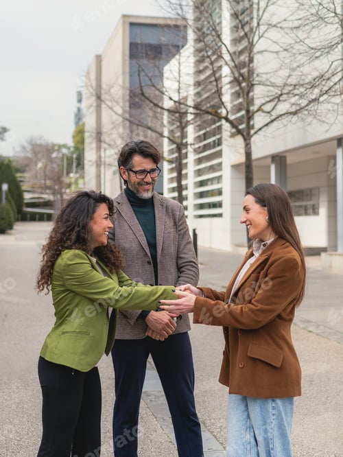 Preview: Business people shaking hands making a successful deal