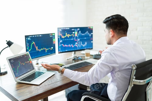 Preview: Worried Young Male Trader Working At Home
