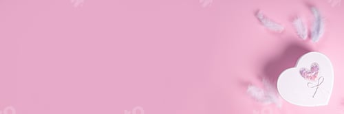 Preview: White gift box with feathers on pink background.