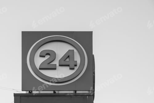Preview: Big Information Sign Or Banner Of Gray Color With Number 24 Against A Clear Sky And A Blank Space