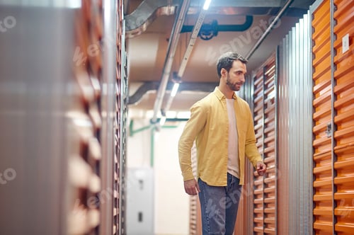 Preview: Man coming up to closed box door