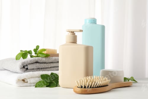 Preview: Spa Products and Towels on a White Table