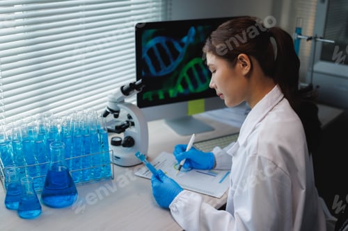 Preview: Female scientist researching dna structure in laboratory