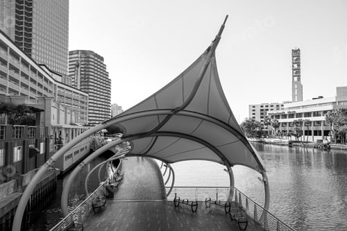 Preview: Grayscale shot of the Tampa Riverwalk surrounded by buildings in Tampa, Florida
