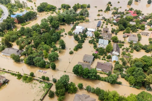 Preview: Aerial view of flooded houses with dirty water of Dnister river in Halych town, western Ukraine