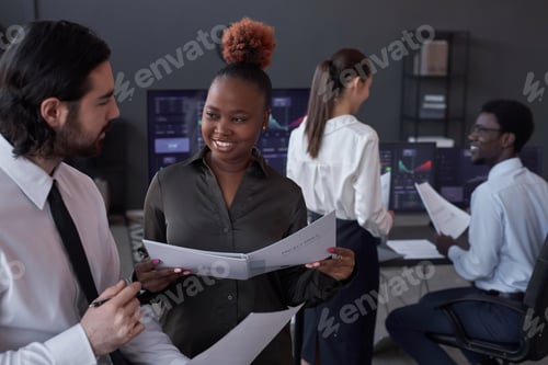 Preview: Colleagues discussing financial market in team
