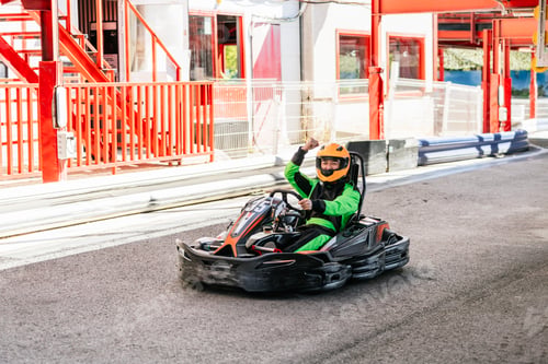 Preview: Person driving go kart on track cheering