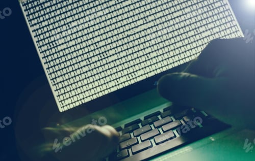 Preview: Hacker looking at binary code