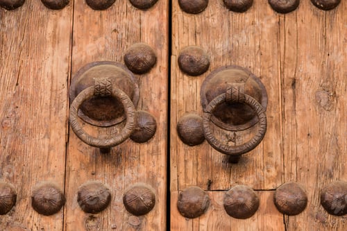 Preview: Old rustic door closeup background. Ornamental gate detail traditional ancient spanish design.