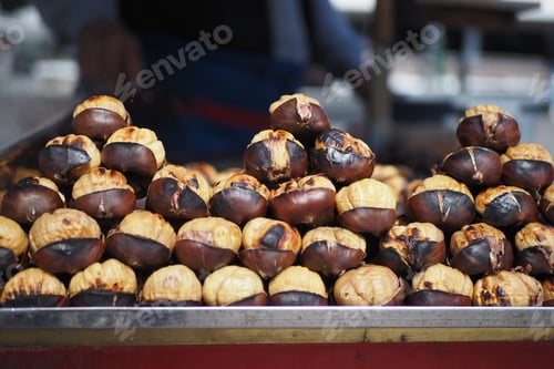 Preview: traditional Istanbul street food grilled chestnuts in a row