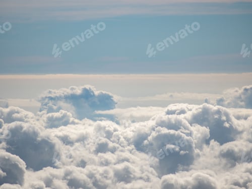 Preview: Beautiful and serene landscape featuring wispy white clouds in a perfectly blue sky on a sunny day