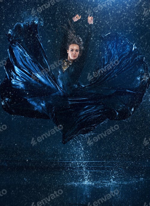 Preview: The young beautiful modern dancer dancing under water drops