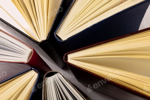 Preview: Image of central composition with books standing on white surface