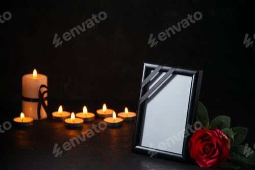 Preview: front view of burning candles with picture frame on dark surface death war evil funeral