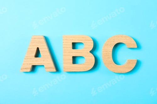 Preview: Wooden letters of English alphabet on color background, space for text