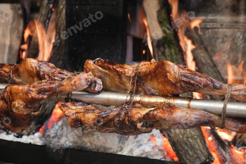 Preview: Grilled roasted mutton meat on spit at street food market