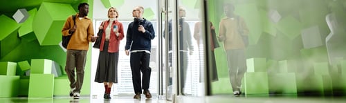 Preview: Header of Young Adults Walking Together in Modern Office Building Corridor
