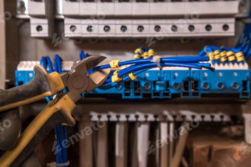 Preview: the Assembly of the electrical panel, electrician job, a robot with wires and circuit breakers