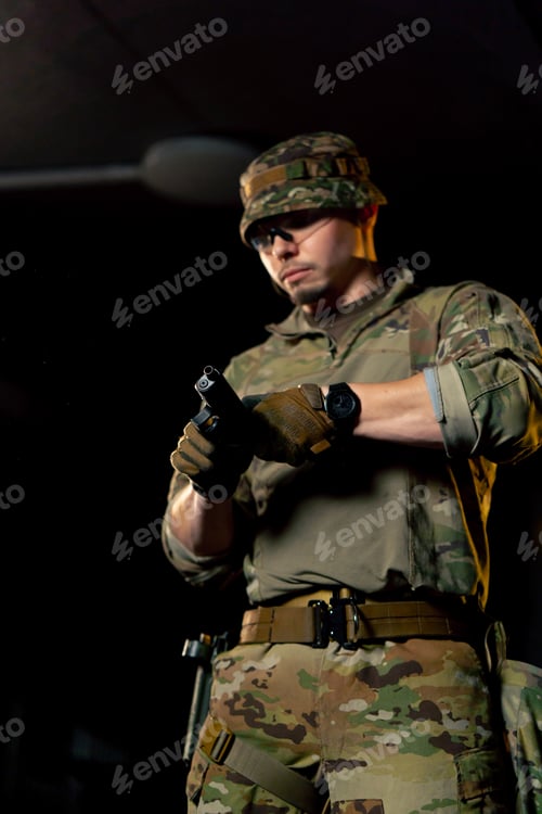 Preview: close-up at a professional shooting range a military trainer reloading a pistol ready to shoot