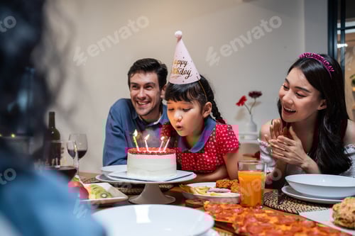 Preview: Multi-ethnic big family having a birthday party for young kid daughter.