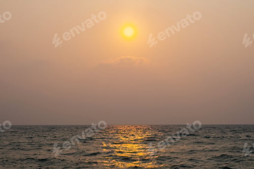 Preview: Sundown reflected on ocean surface. Inspiration summertime background.