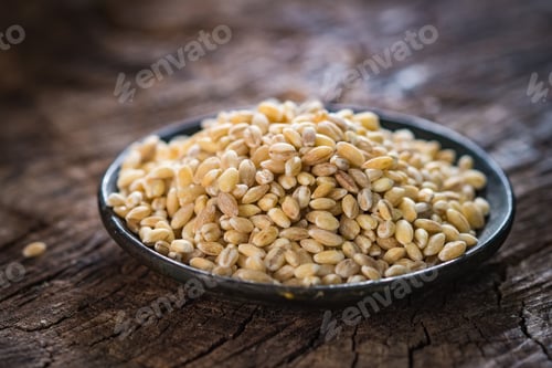 Preview: Dry pearl barley on rustic background