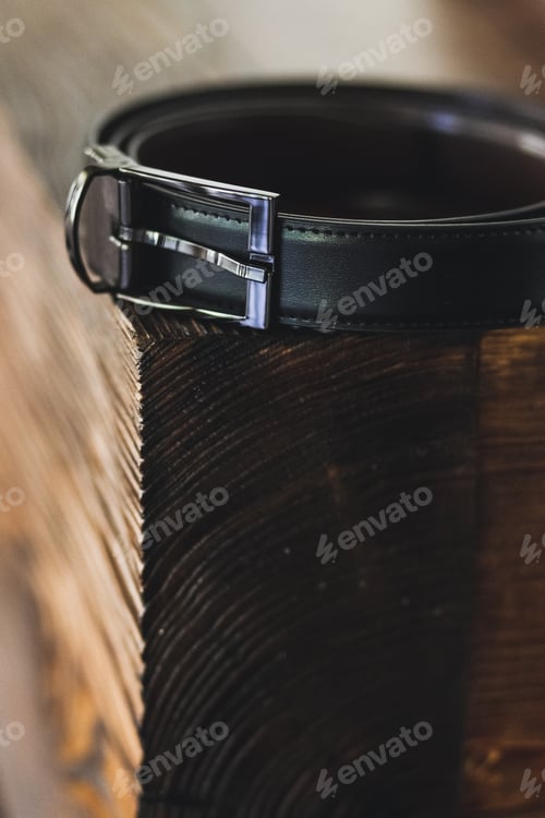 Preview: Black men's belt on a wooden stand