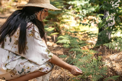 Preview: Woman enjoying a day in nature in the forest