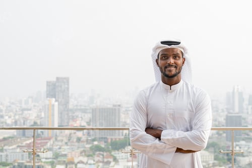Preview: Portrait of African Muslim man wearing religious clothing an scarf at rooftop in city