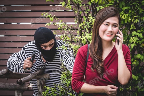 Preview: Thief is holding a gun and looking at Asian woman
