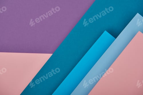 Preview: top view of blue, pink and violet paper sheets with copy space