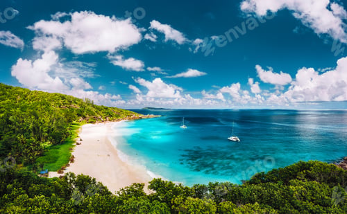 Preview: Grand Anse beach at La Digue island in Seychelles aerial panoramic view. White sandy beach with blue