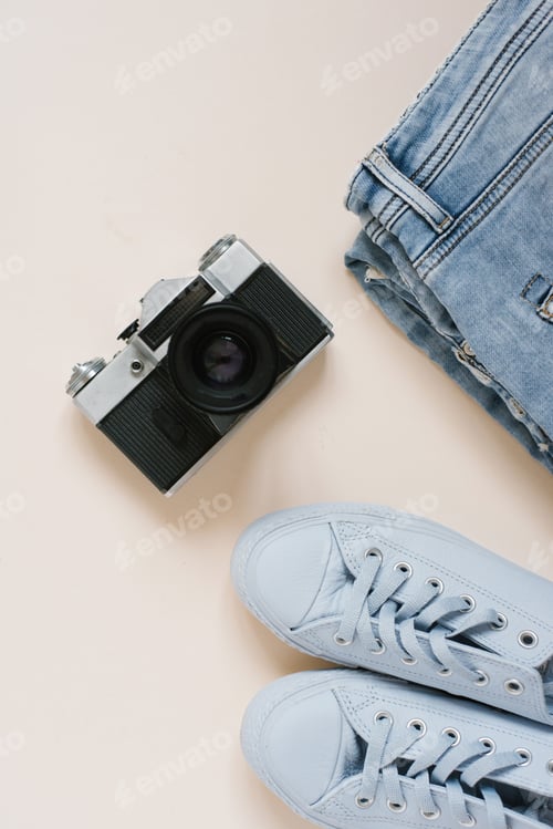 Preview: Accessories for urban travel. Jeans, sneakers, top view camera