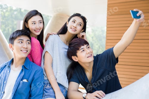 Preview: Young friends taking self portrait with a smart phone