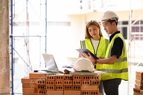 Preview: Team of inspectors working and discussing about construction project together.