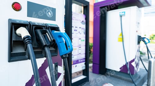 Preview: Electric car charging station. Electric vehicle charger. Charging point at outdoor car parking lot.