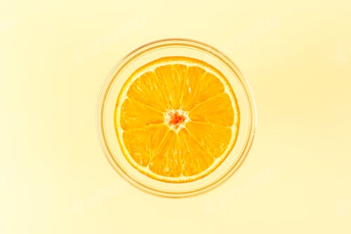 Preview: a front view sliced orange round fresh juicy mellow and fresh inside round transparent bowl isolated