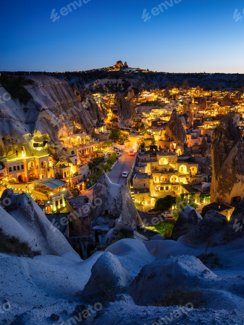 Preview: Goreme, Cappadocia, Turkey. View of the evening city from the mountain. Bright evening city and clea